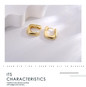 Detailed view of gold geometric square hoop earrings with polished metallic texture