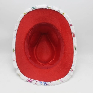 Interior view of red velvet Christmas cowboy hat with white faux fur and colorful sequins