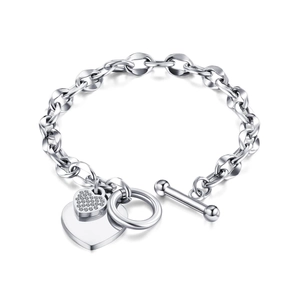 Silver heart pendant chain bracelet with toggle clasp and pave crystals on white background
