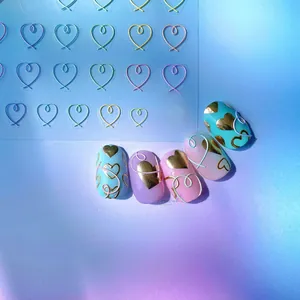 Detailed view of 5D embossed heart nail art stickers showing 3D metallic texture effects