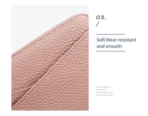 Detail of soft pink lychee grain leather wallet with high-quality white stitching