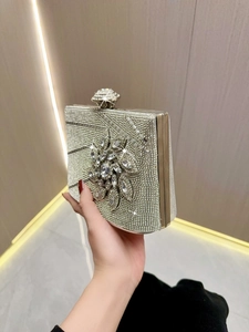 Elegant silver rhinestone clutch bag with 3D floral crystals for evening parties