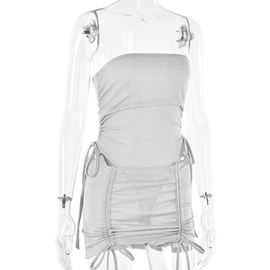 Close-up of silver glitter tube top and mini skirt set with drawstring ruching detail
