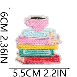 Detail showing dimensions of the embroidered book and coffee cup patch, 6x5.5cm size