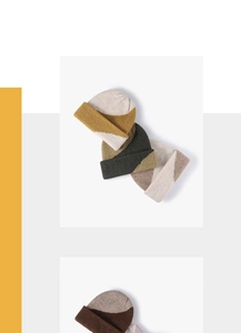 Detailed view of color-blocked ribbed knit beanies in various warm wool blend patterns