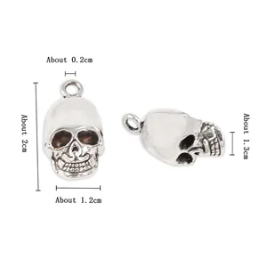 Detailed size specifications for alloy skull pendant showing 2cm height and 1.2cm width