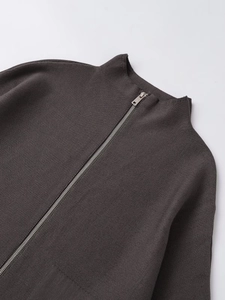 Detail of dark grey knit cardigan with stand collar and smooth silver metal zipper
