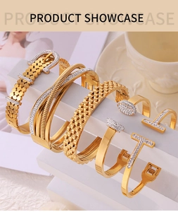 Detailed view of luxury gold-plated titanium steel bracelets with pavé zircon settings