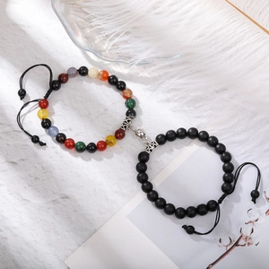 Macro shot of natural tiger eye magnetic bracelets for couples with adjustable cords