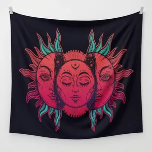 Detail of bohemian sun and moon tapestry with red and teal mandala pattern decor