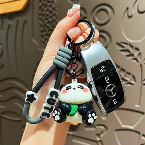 Cute UV plated cartoon panda keychain with resin pendant and metal ring on hand