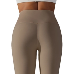 High-waist brown yoga leggings featuring seamless butt-lifting V-shaped stitching
