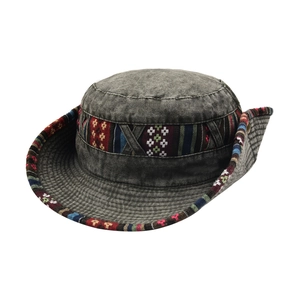 Detail of grey outdoor sun hat with ethnic bohemian colorful woven band decoration