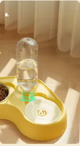 Detail view of ginger yellow 2-in-1 pet feeder with automatic water bottle and steel bowl