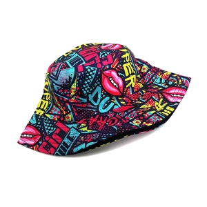 Deep blue bucket hat with pop art graffiti prints including red lips and letters