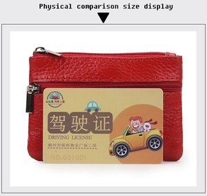Detail of red pebbled leather coin purse with double silver zippers and card slot