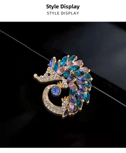 Detail of hedgehog brooch with multi-colored crystals and gold-tone alloy base