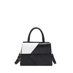 Elegant black and white contrast crocodile pattern handbag with top handle and shoulder strap