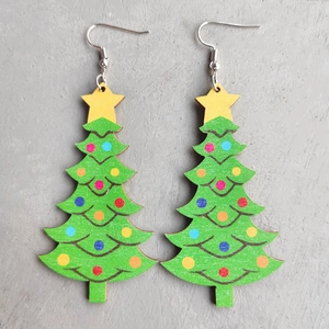 Detailed top view of green Christmas tree earrings with colorful ornaments and star charms