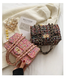 Close-up of elegant tweed crossbody bags with gold metal chain and turn-lock closure