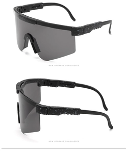 Macro view of black cycling sunglasses with gray speckled frame and tinted lenses