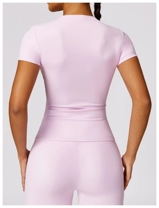 Rear view of a slim-fit quick-dry yoga set showing stretchy purple t-shirt and high waist pants