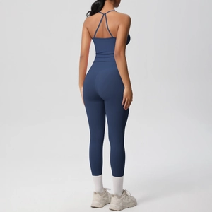 Rear view of dark blue yoga set showing racerback tank top and high waisted leggings