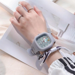 Close-up of square gray silicone watch featuring a cute cartoon mouse and woven bracelet