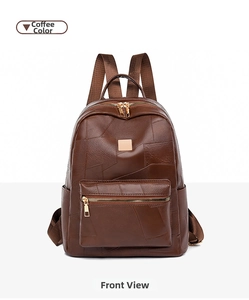 Front view of a brown patchwork textured backpack with gold-tone zippers and pockets
