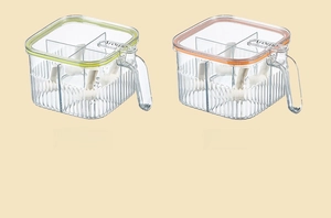 Detail of four-grid seasoning box with ergonomic handle and transparent colored lids