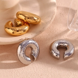 Detail of 18K gold and silver plated 30mm hammered texture hollow hoop earrings