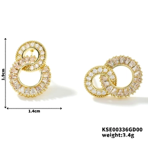 Detail view of 1.9cm gold-plated figure-8 earrings with micro-pave cubic zirconia