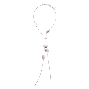 Minimalist silver long tassel necklace featuring multiple polished metal round discs