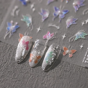 5D butterfly embossed nail art stickers with iridescent pearls and glitter details