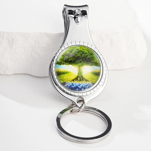 Silver metal nail clipper keychain with Tree of Life glass cabochon pendant