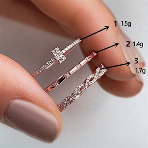 Three-piece rose gold zircon stacking rings set featuring geometric and woven designs
