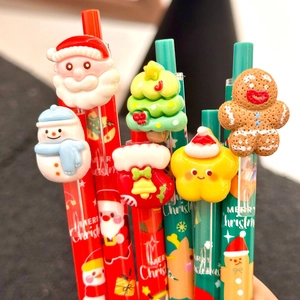 Christmas click gel pens featuring 3D resin Santa and reindeer toppers on red and green barrels