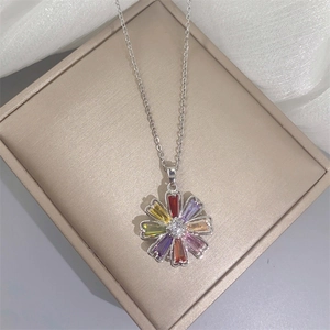 Silver flower necklace with colorful baguette gemstones and a sparkling center zircon