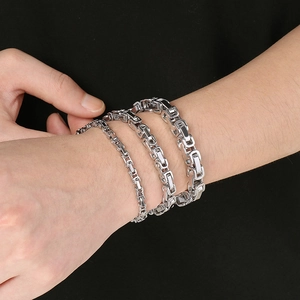 Byzantine titanium steel bracelets for men in three widths worn on model's wrist