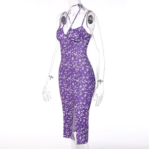 Detailed view of purple floral slip dress featuring side slit and ruched bust details
