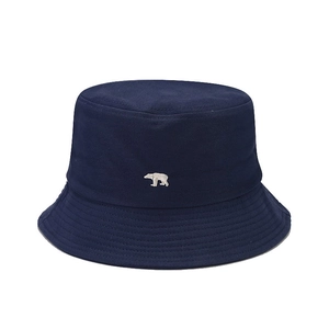 Navy blue cotton bucket hat featuring a white polar bear embroidery on plain white background