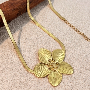 French vintage gold flower necklace with ribbed petals and sleek snake chain for women