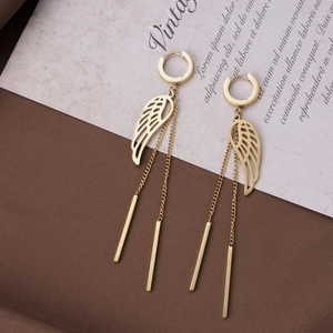 Elegant gold wing tassel drop earrings with round buckles on vintage background