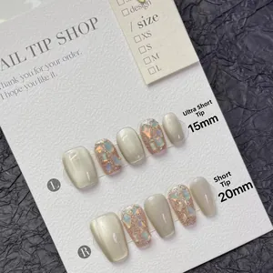 Cat eye glitter press-on nails in iridescent silver with short coffin nail shapes
