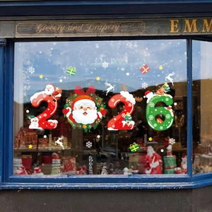 Colorful 2026 Christmas window decals with Santa and reindeer on store glass display