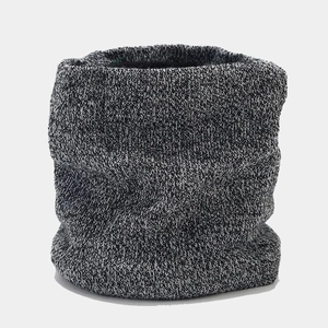 Detail of winter thermal knit neck warmer with thick texture and mixed grey pattern