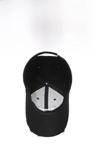 Detail view of the black baseball cap showing interior stitching and breathable vents