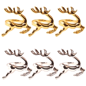 Set of 6 metal reindeer napkin rings in polished gold and silver finishes on white