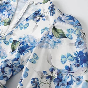 Detail of floral puff sleeve dress with zipper neckline and M-size collar label
