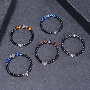 Set of 5 magnetic couples bracelets with black matte beads and natural tiger eye stones